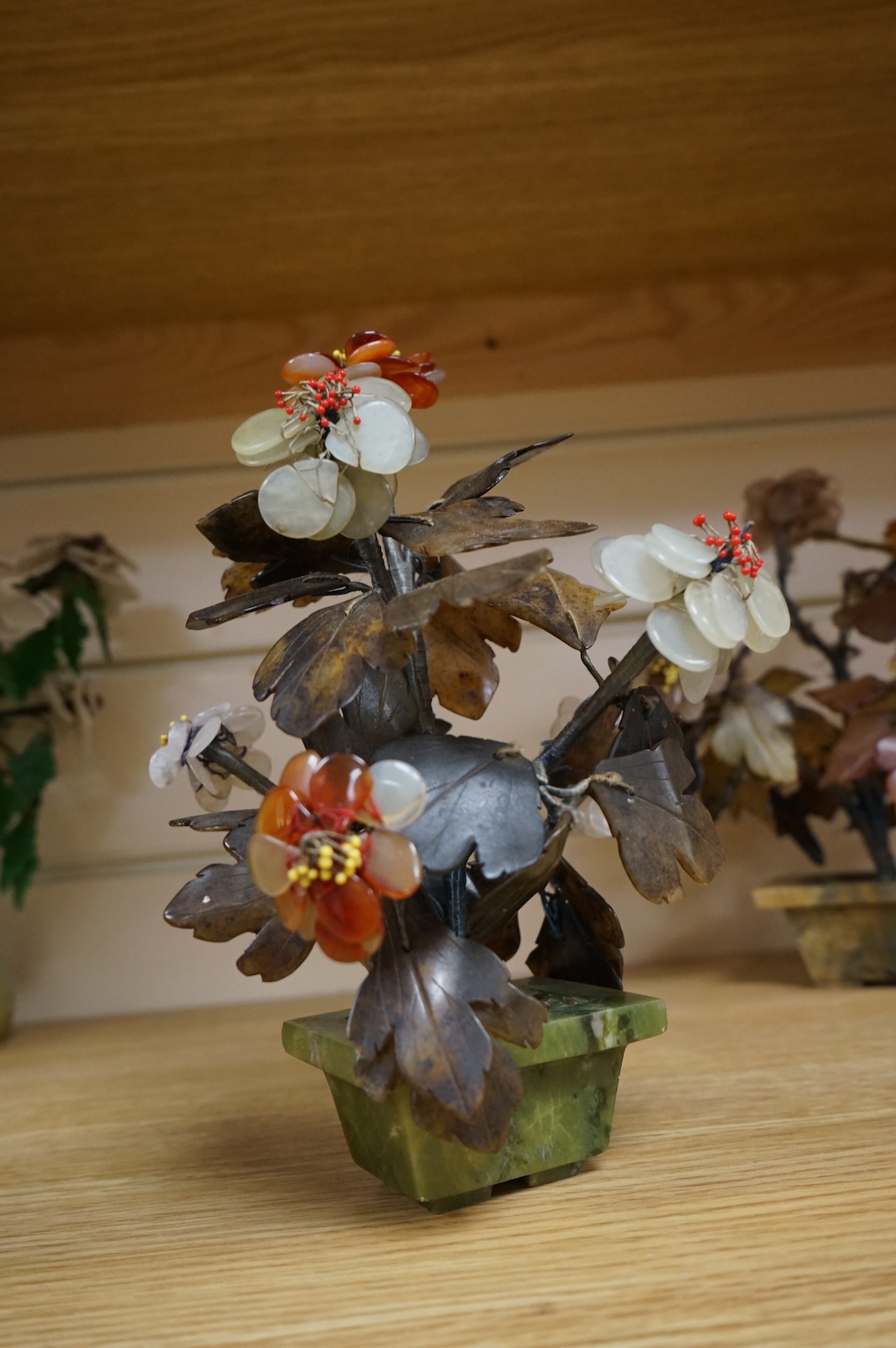 A collection of four ornamental Chinese hardstone flowering trees, tallest 22cm.